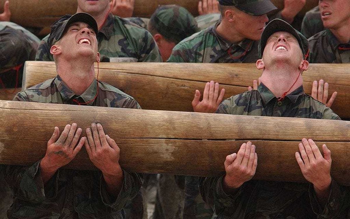 Navy SEALs students participate in Log PT (physical training) during "Hell Week" in Coronado, California.
