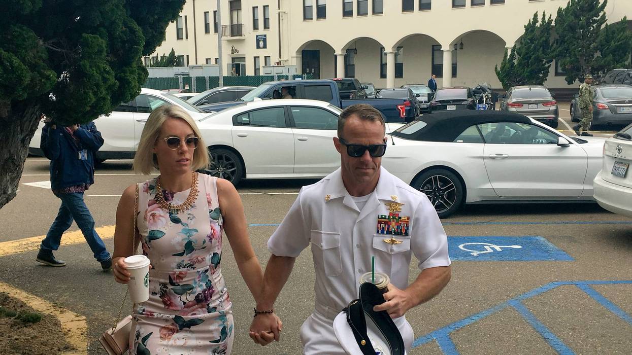 Navy Special Operations Chief Edward Gallagher, right, walks with his wife, Andrea Gallagher, as they arrive to military court on Naval Base San Diego, Thursday, June 20, 2019, in San Diego.