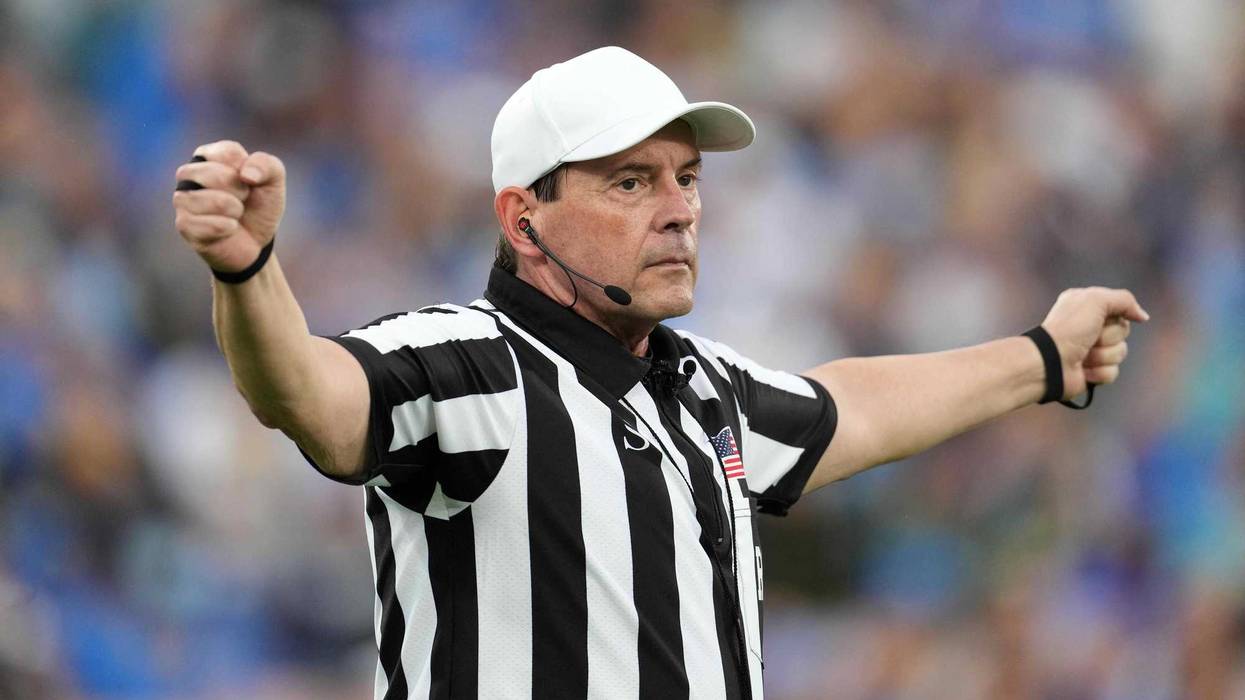 NCAA referee Mark Duddy gesturesin the second half of the game between the UCLA Bruins and the Oregon Ducks at Rose Bowl. Oregon defeated UCLA 34-31.