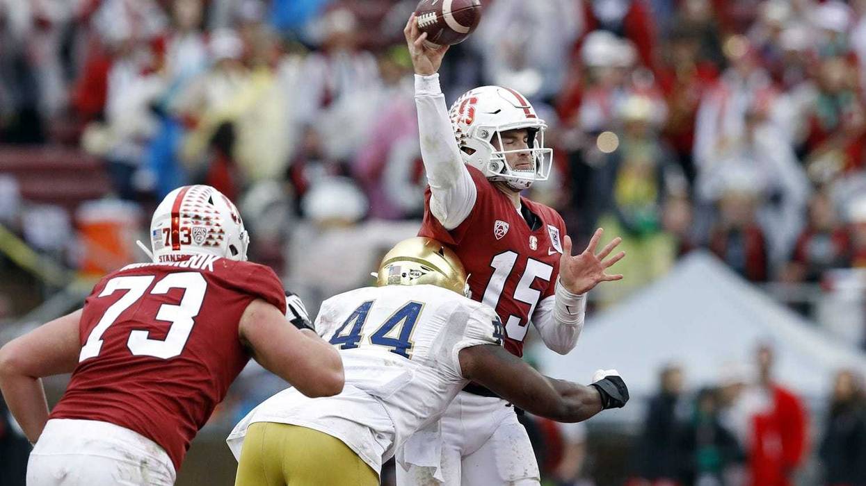 ND's Jamir Jones (44) hits Stanford Cardinal quarterback Davis Mills