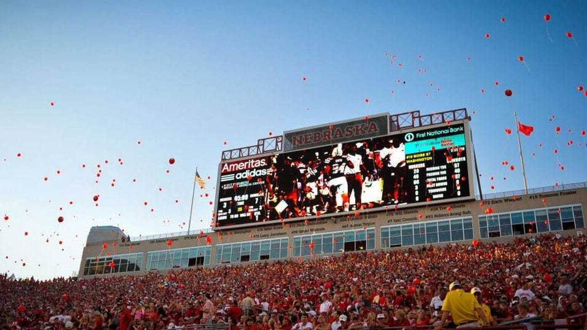 Nebraska fans release red balloons after the Nebraska Cornhuskers score their first points of the game against the Wyoming Cowboys at Memorial Stadium on August 31, 2013 in Lincoln, Nebraska.