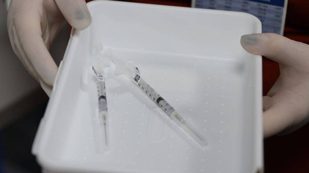 Needles with the Pfizer-BioNtech COVID-19 vaccine are seen