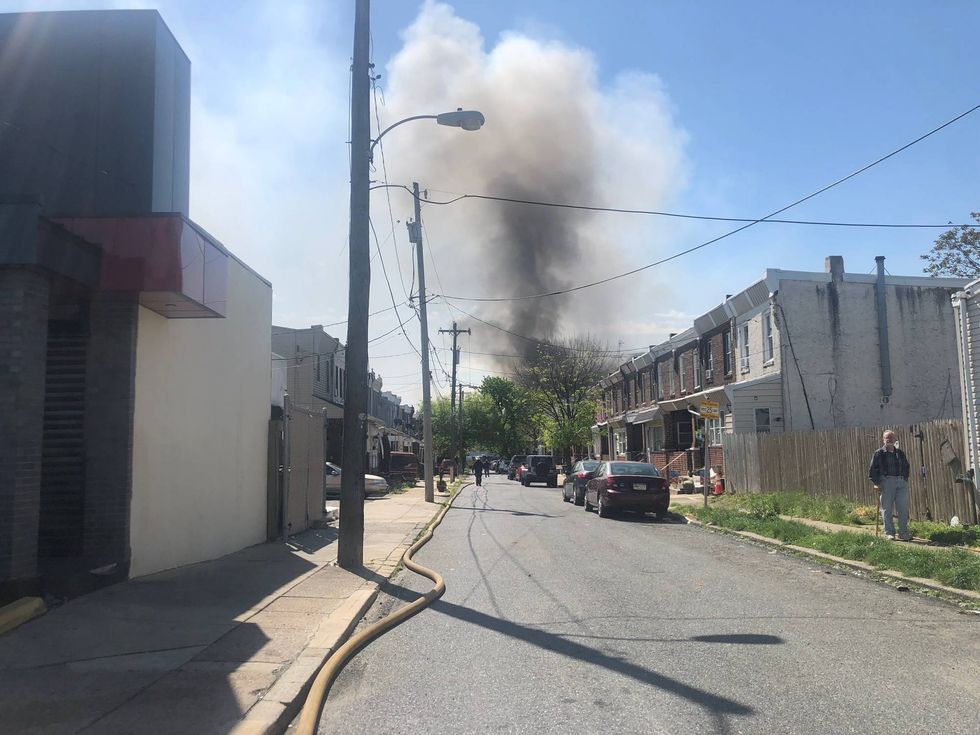 Neighbors could see plumes of smoke rising from the site of a warehouse fire on Monday in Northeast Phladlelphia.