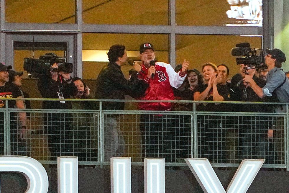 Neil Diamond perform Sweet Caroline during the eighth inning of a game between the St. Louis Cardinals and Boston Red Sox at Fenway Park.