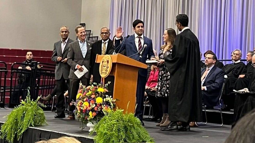 Neil Makhija being sworn in as a Montgomery County commissioner