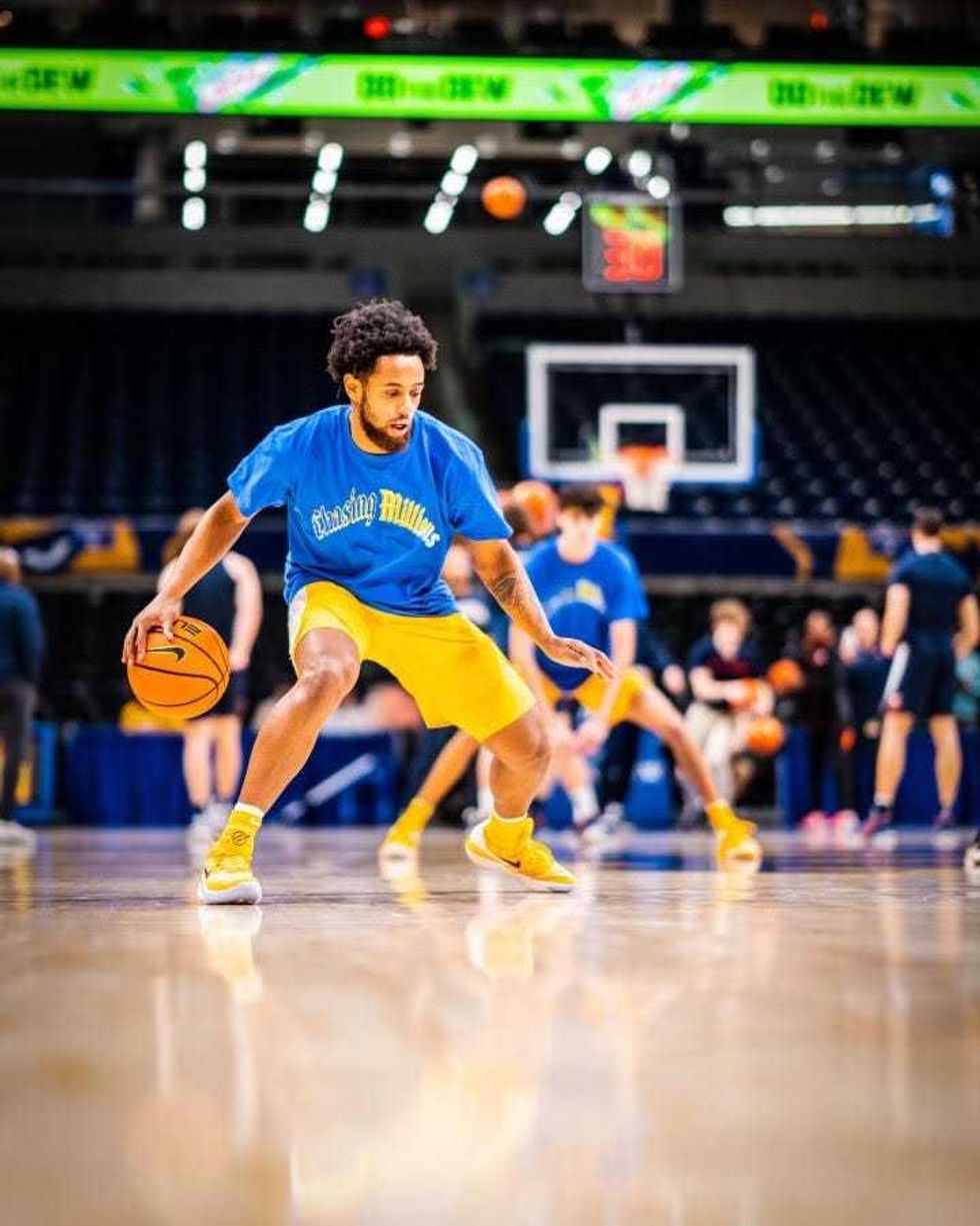 Nelly Cummings in warmups with Damar Hamlin shirt