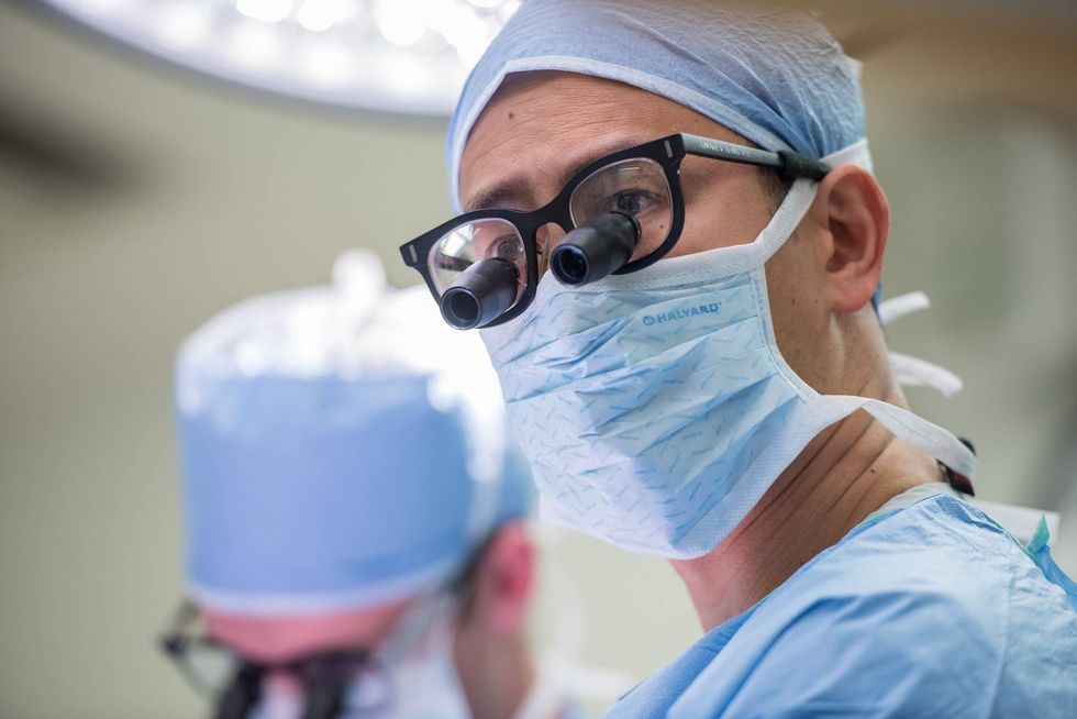 Neurosurgeon Edward Chang performs brain surgery at UCSF.