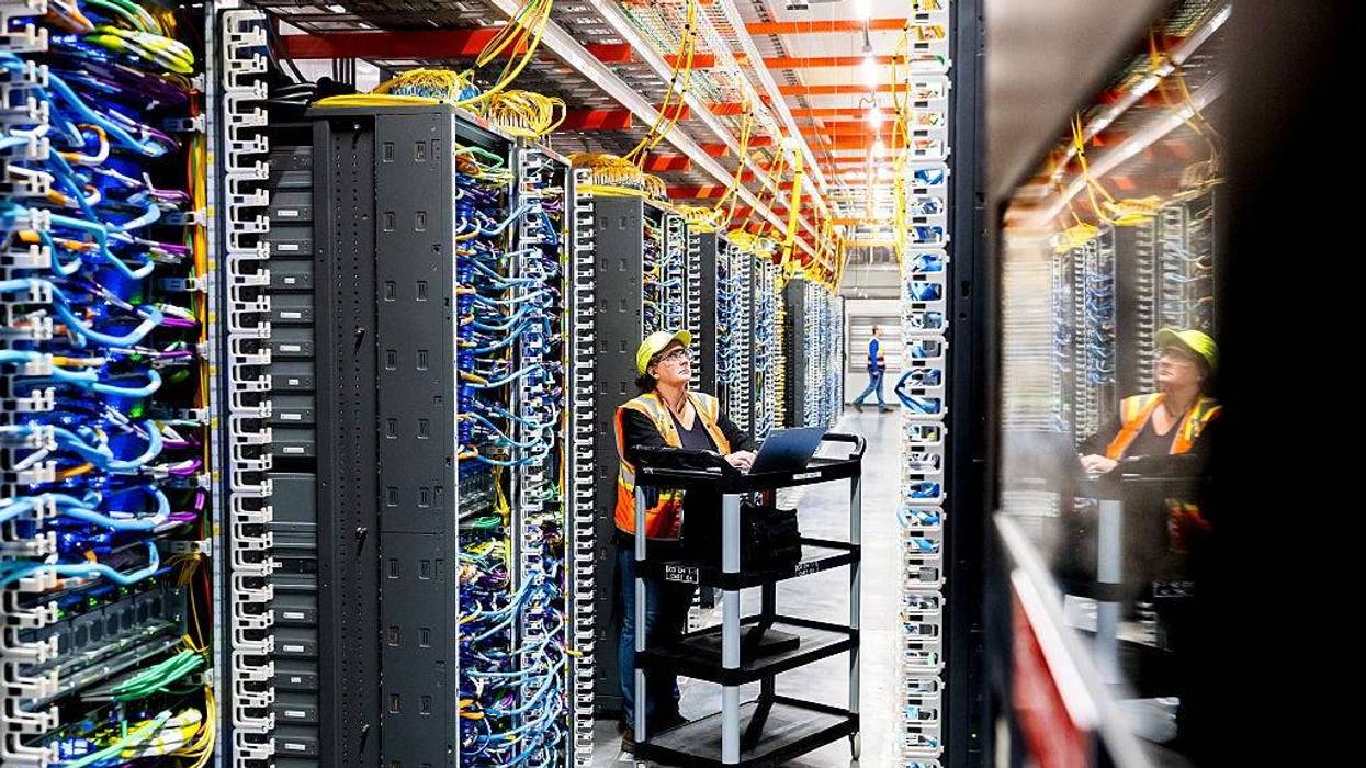 NEW CARLISLE, INDIANA - OCTOBER 2: In this handout provided by Amazon, a technician works at an Amazon Web Services AI data center in New Carlisle, Indiana on October 2, 2025. (Photo by Noah Berger/Getty Images via Amazon Web Services)