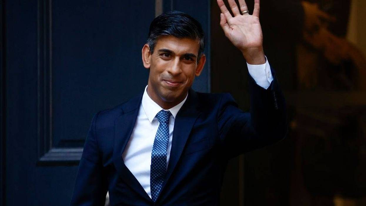 New Conservative Party leader and incoming prime minister Rishi Sunak waves as he departs Conservative Party Headquarters on October 24,2022 in London, England.