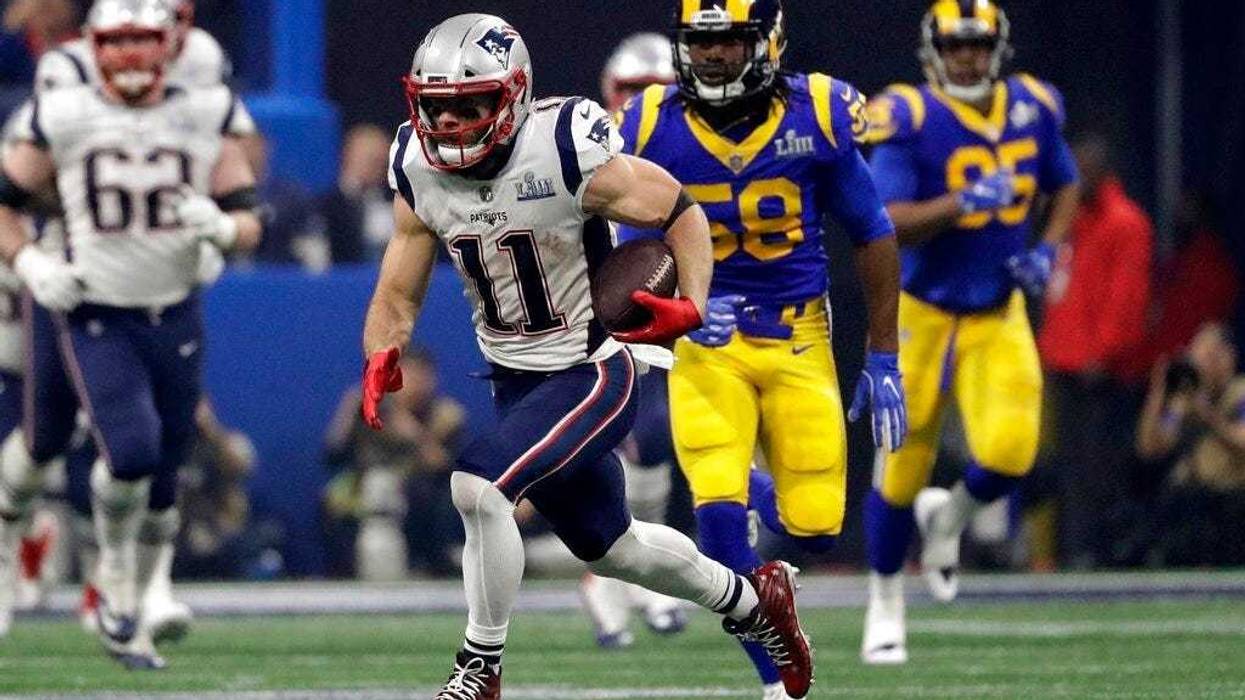 New England Patriots' Julian Edelman (11) runs the ball ahead of Los Angeles Rams' Cory Littleton (58) during the second half of the NFL Super Bowl 53 football game Sunday, Feb. 3, 2019, in Atlanta.