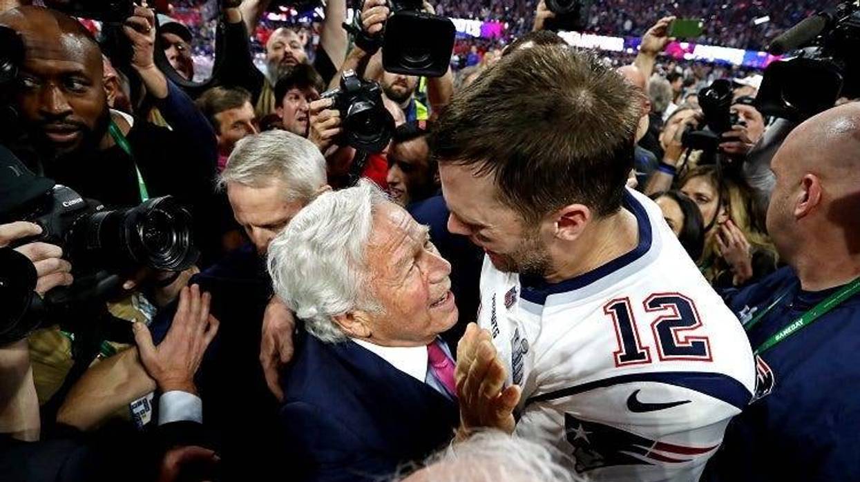 New England Patriots quarterback Tom Brady (12) celebrates with New England Patriots owner Robert Kraft after the Los Angeles Rams in Super Bowl LIII at Mercedes-Benz Stadium.
