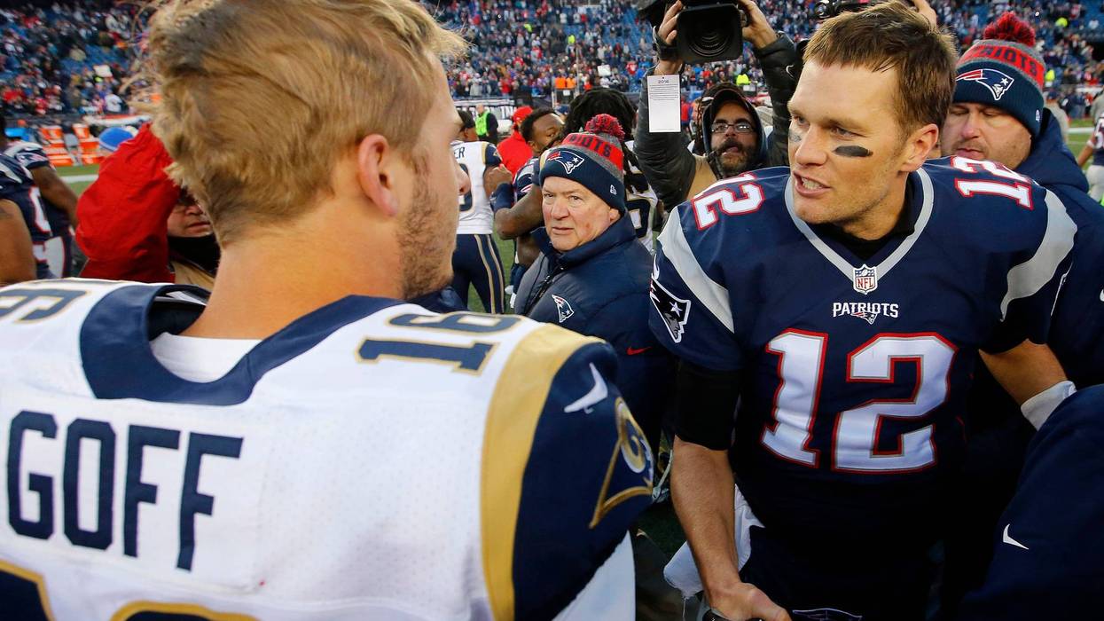 New England Patriots quarterback Tom Brady (12) is congratulated by Los Angeles Rams quarterback Jared Goff