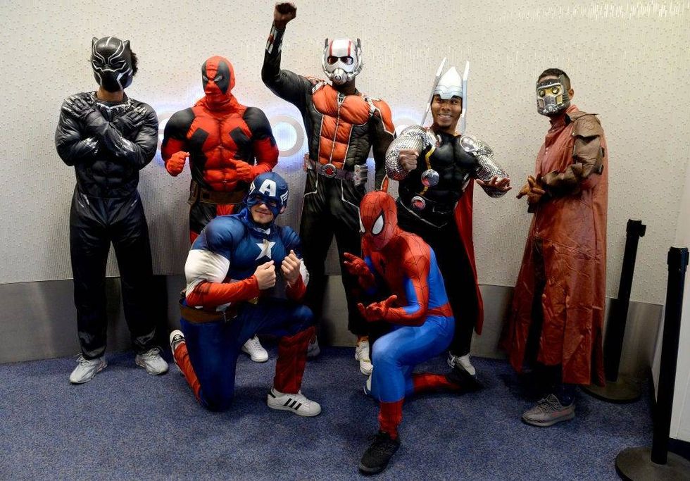 New England Revolution (L to R) Tajon Buchanan, Nico Firmino, Justin Rennick, Wilfried Zahibo, Dejuan Jones, Charlie Davies, and Michael Mancienne prepare to visits the kids in costume at Boston Children