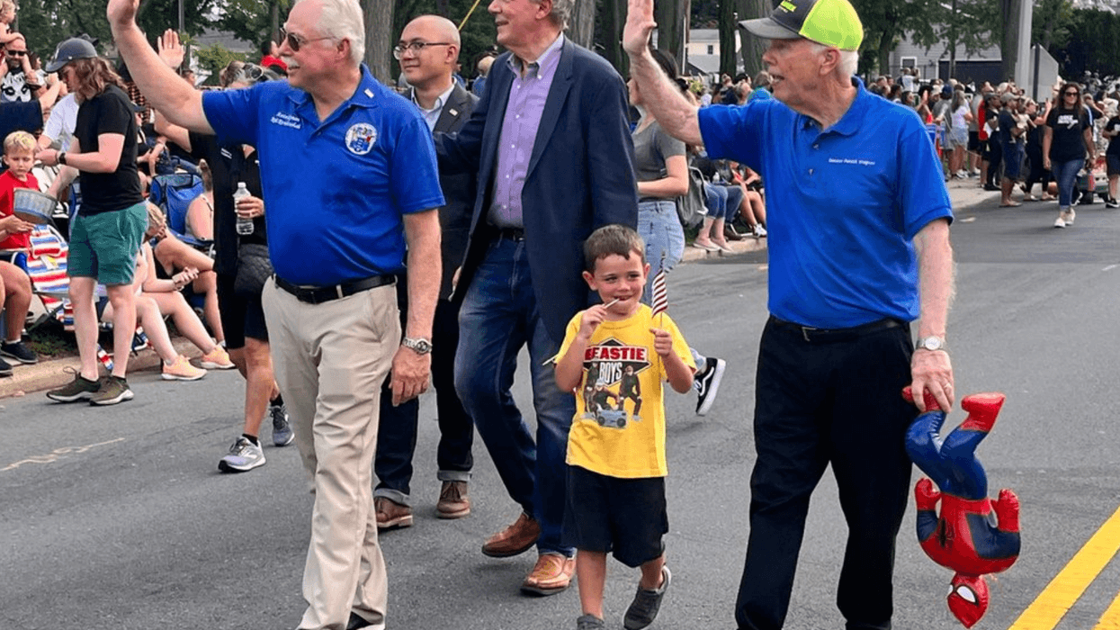 New Jersey Assemblyman Rob Karabinchak walks with other officials in the 63rd annual South Plainfield Labor Day parade on Monday.