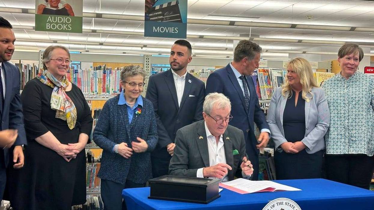 New Jersey Gov. Phil Murphy at the Princeton Public Library on Monday, Dec. 9, 2024, signs legislation aimed at barring public libraries and schools from banning books.
