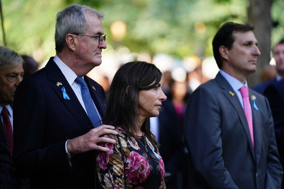 New Jersey Gov. Phil Murphy (L) and his wife Tammy Murphy attend the remembrance ceremony