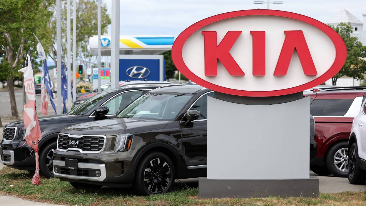 New Kia cars are displayed on a sales lot in California on May 30, 2023.