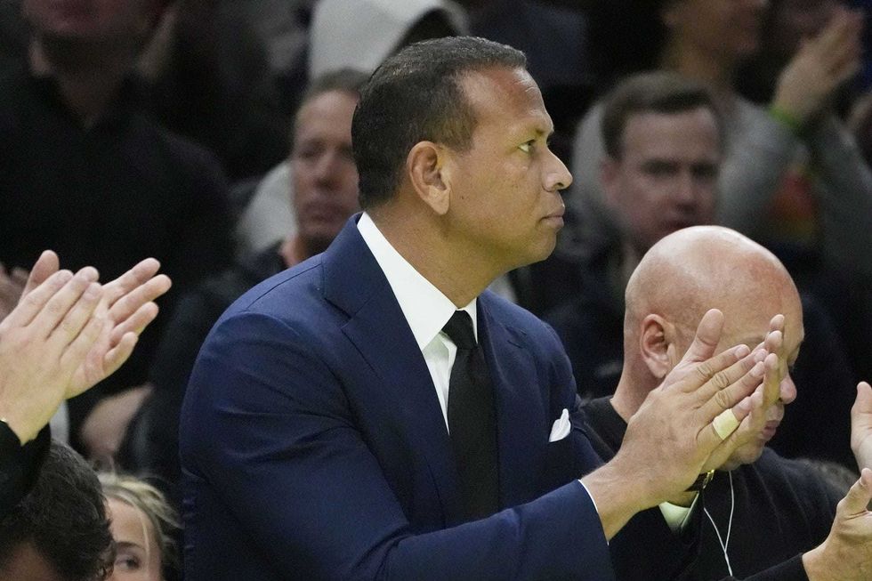 New Minnesota Timberwolves minority owner Alex Rodriguez cheers his team on as they play the Sacramento Kings in the fourth quarter at Target Center.