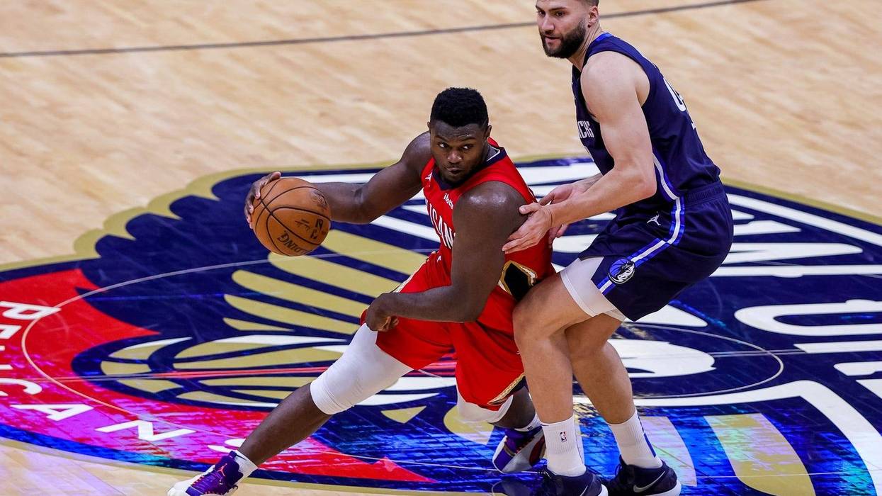 New Orleans, Louisiana, USA; New Orleans Pelicans forward Zion Williamson (1) dribbles around Dallas Mavericks forward Maxi Kleber (42) during the second half at the Smoothie King Center.