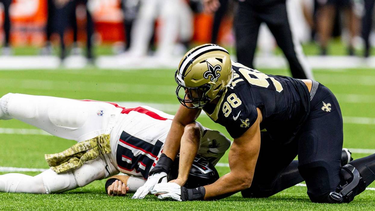 New Orleans Saints defensive end Payton Turner (98) forces a fumble on Atlanta Falcons quarterback Kirk Cousins (18) during the first half at Caesars Superdome.