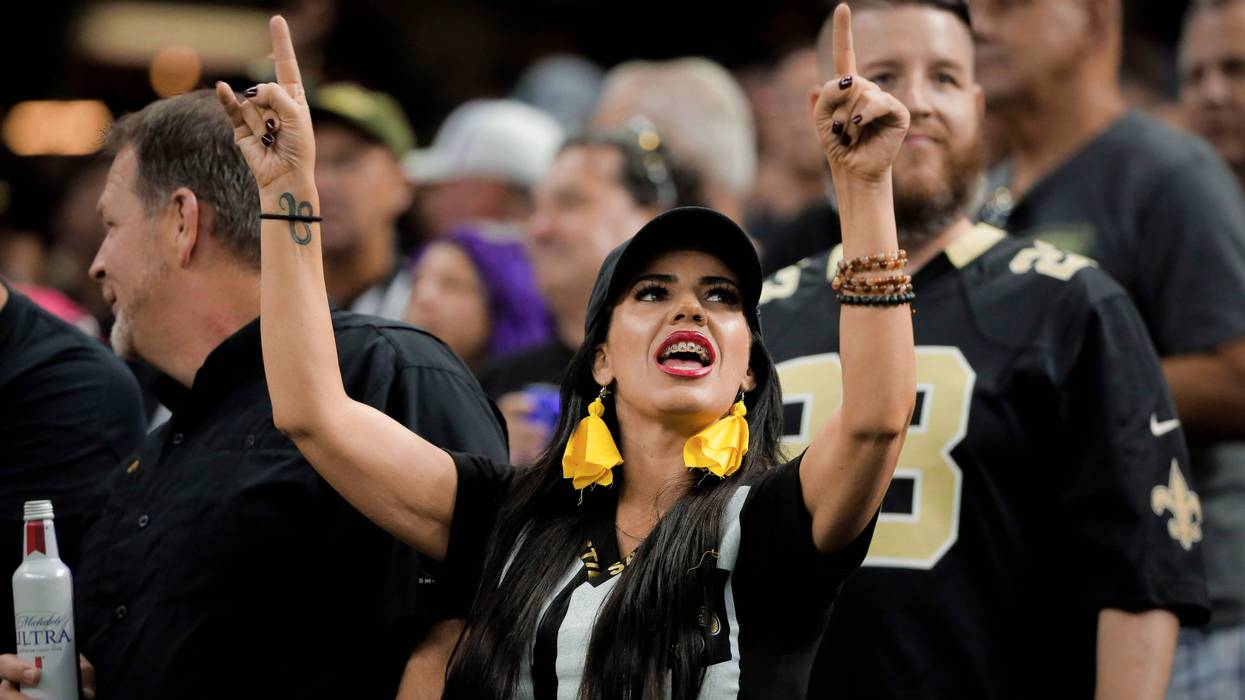 New Orleans Saints fans dress as referees against the Houston Texans for a game at the Mercedes-Benz Superdome.