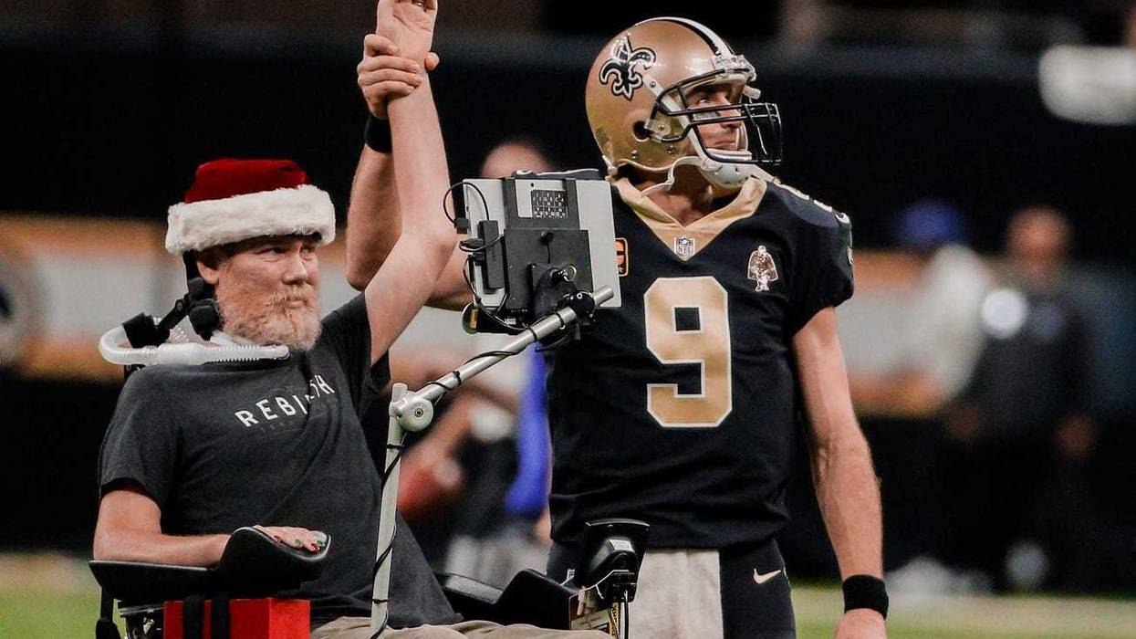 New Orleans Saints quarterback Drew Brees (9) leads the who dat chant with former player Steve Gleason