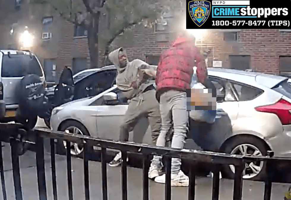 New video from police shows two males beating and stabbing a victim while robbing him in the Morrisania section of the Bronx on May 7