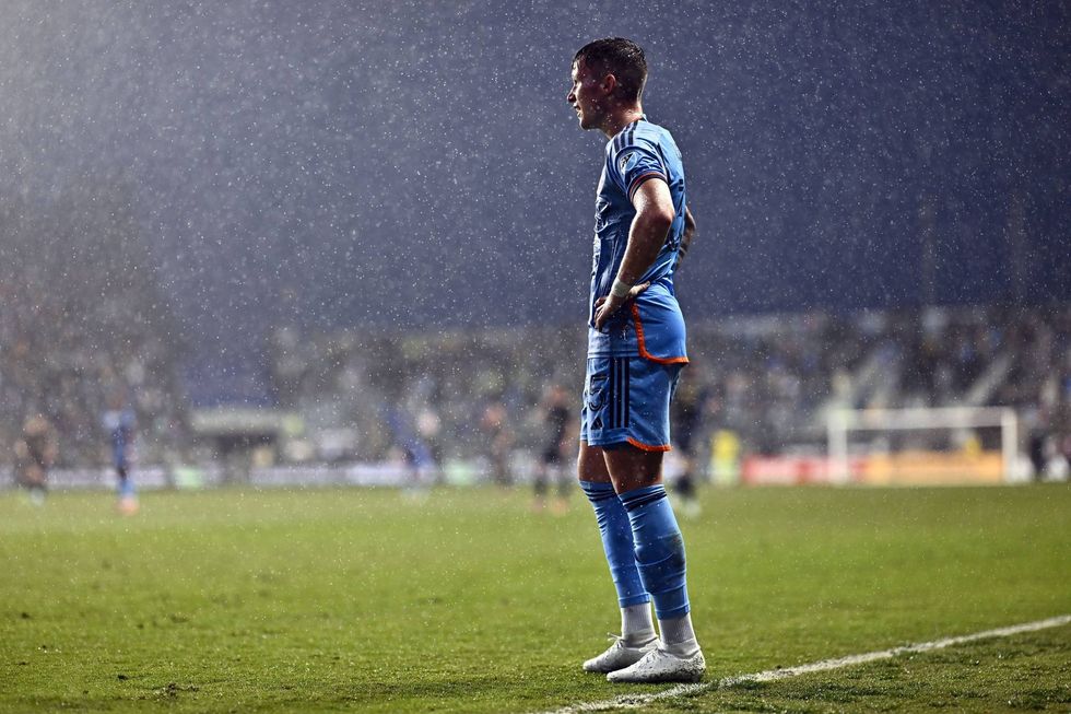 New York City FC defender Mitja Ilenic looks on as the Subaru Park ground crew chase a raccoon who interrupted the first half of a match against the Philadelphia Union.