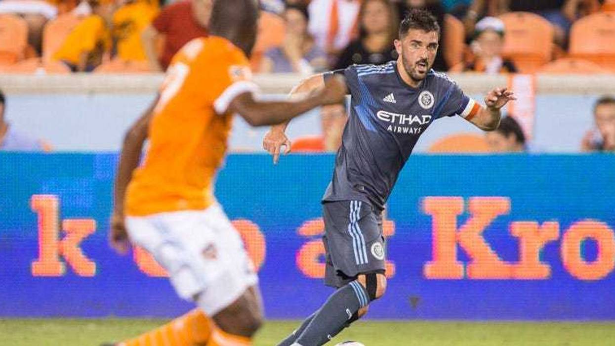 New York City forward David Villa controls the ball as Toronto FC midfielder Jonathan Osorio (21) and defender Nick Hagglund on Aug. 12, 2018, at Yankee Stadium.