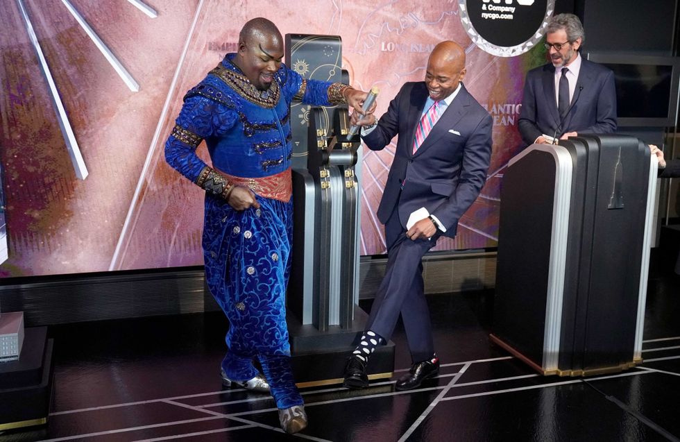 New York City Mayor Eric Adams and Michael James Scott participate in a ceremonial lighting of the Empire State Building in New York on January 18, 2022 to launch
