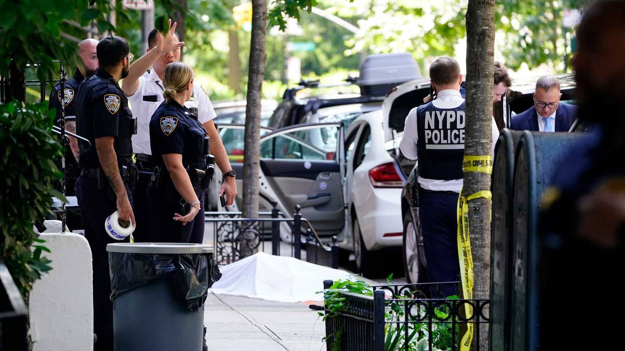 New York City police officers and detectives investigate a shooting near Gracie Mansion, July 26, 2024 in Manhattan.