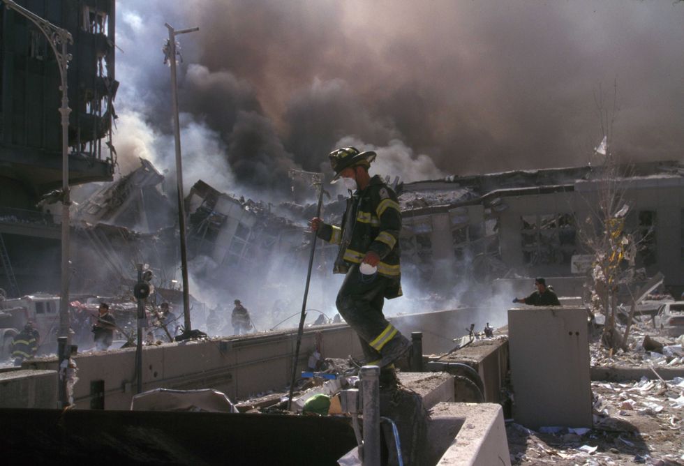 New York Firefighters amid the rubble of the World Trade Centre following the 9/11 attacks.