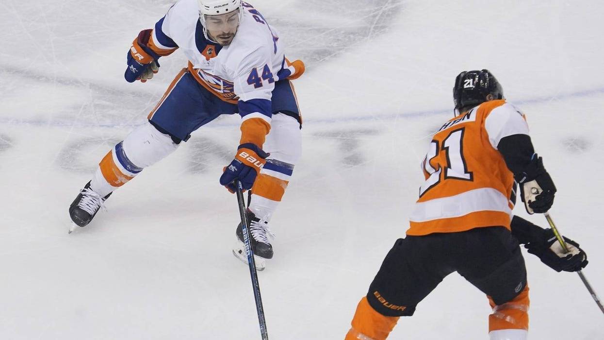 New York Islanders center Jean-Gabriel Pageau (44) defends against Philadelphia Flyers center Scott Laughton (21) during the third period in game one of the second round of the 2020 Stanley Cup Playoffs at Scotiabank Arena.