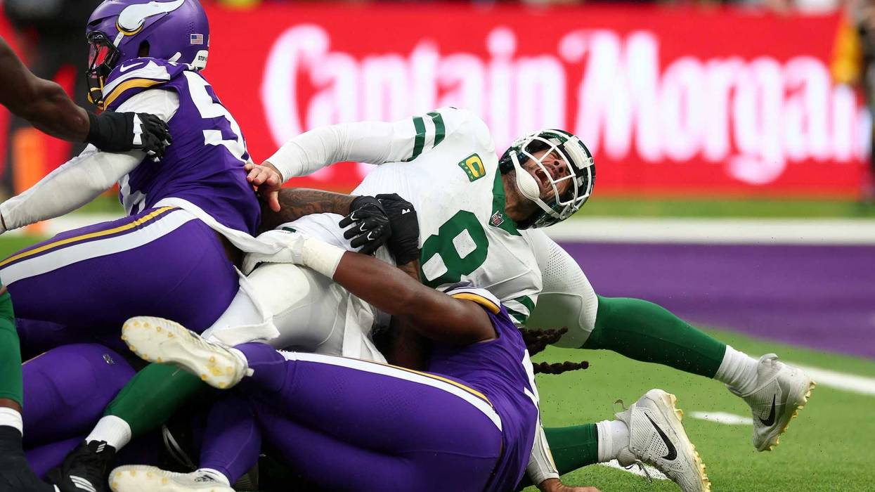 New York Jets quarterback Aaron Rodgers (8) suffers an injury after a tackle from Minnesota Vikings Linebacker Patrick Jones II (91) in the 3rd Quarter at Tottenham Hotspur Stadium.