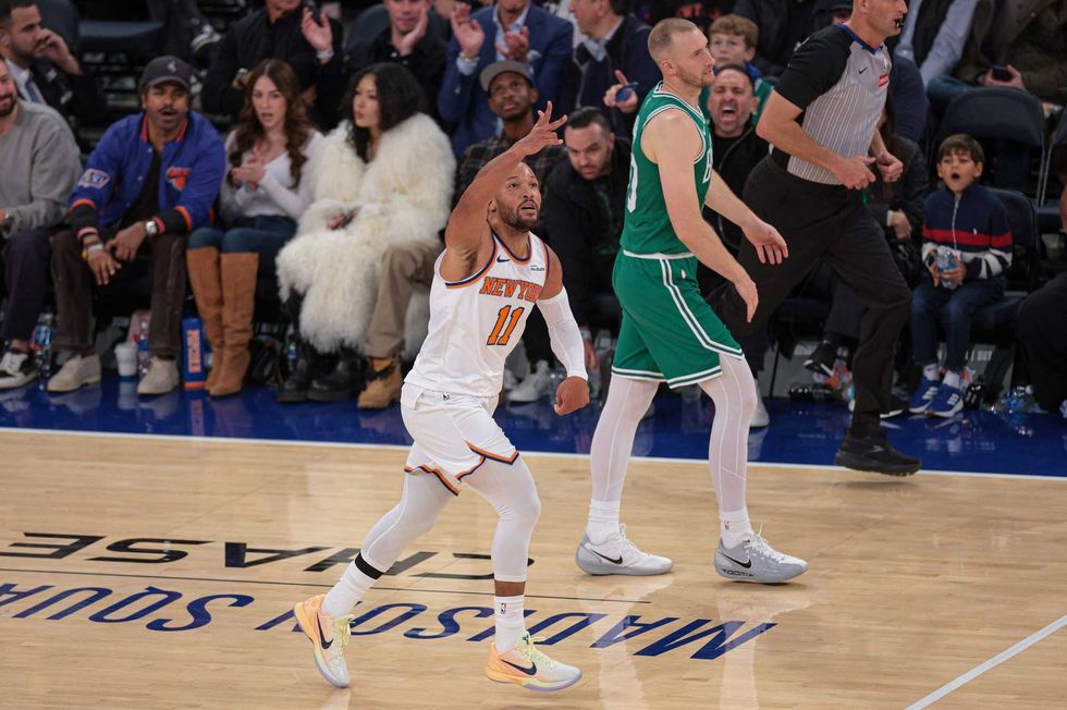 New York Knicks guard Jalen Brunson (11) reacts after making a three point basket during the fourth quarter against the Boston Celtics at Madison Square Garden.