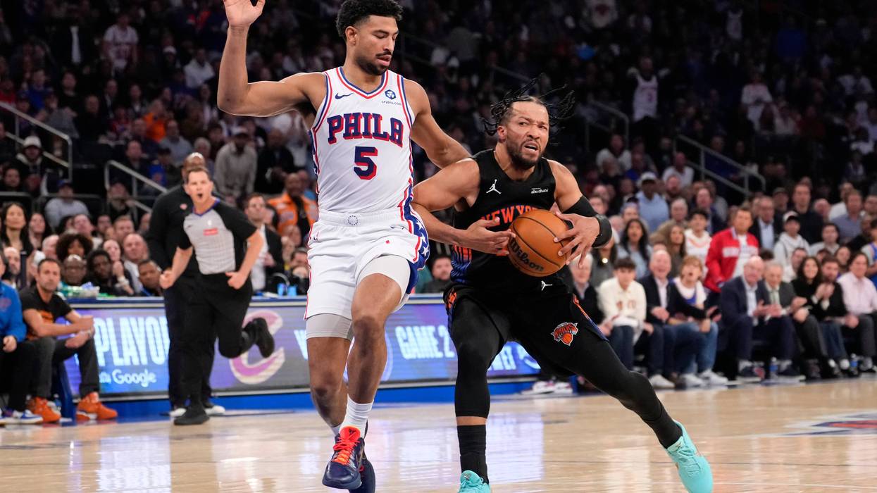 New York Knicks guard Jalen Brunson, right, drives past Philadelphia 76ers guard Quentin Grimes during the first half of Game 2 in a second-round NBA basketball playoffs series, Wednesday, May 6, 2026, in New York.