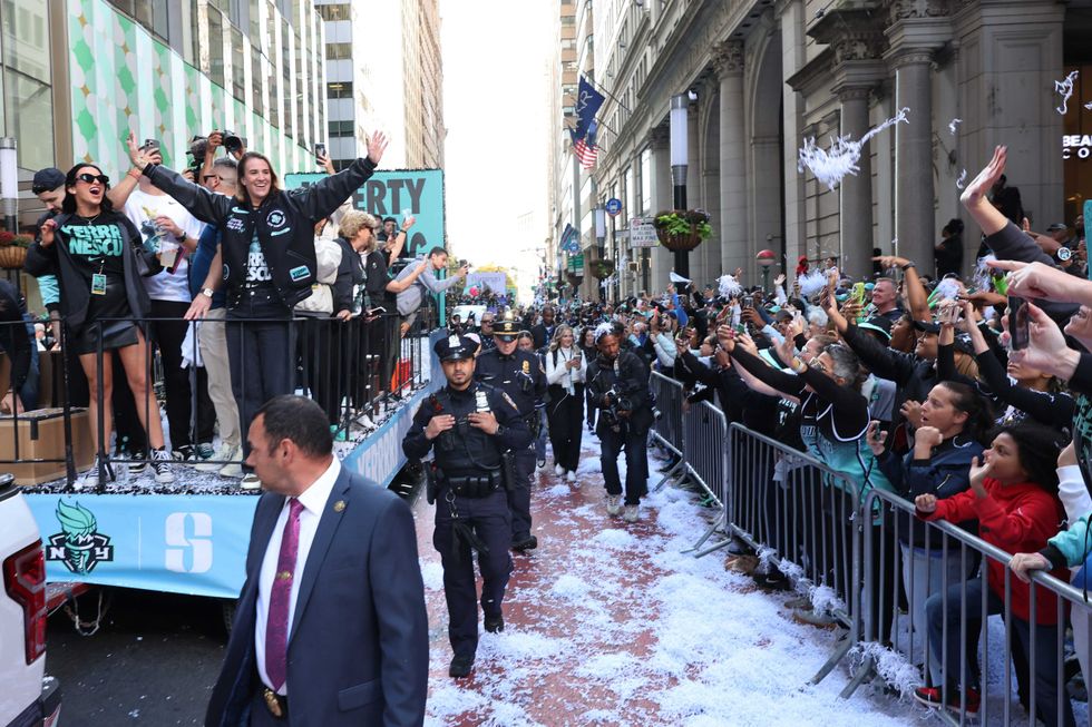 New York Liberty Guard Sabrina Ionescu celebrates the team winning the WNBA championship during their parade on October 24, 2024
