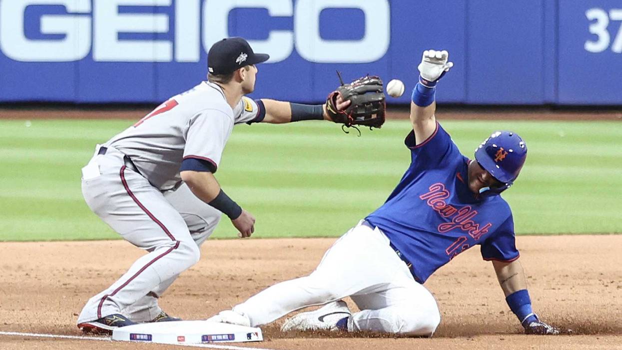 New York Mets catcher Luis Torrens (13) slides safely ahead of the throw to Atlanta Braves third baseman Austin Riley (27) in the third inning at Citi Field.
