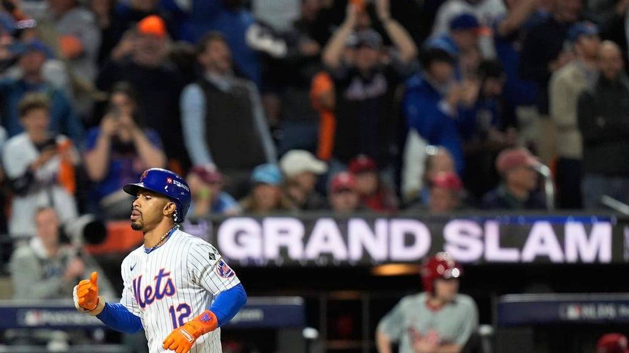 New York Mets' Francisco Lindor rounds the bases after hitting a grand slam home run against the Philadelphia Phillies during the sixth inning of Game 4 of the National League baseball playoff series, Wednesday, Oct. 9, 2024, in New York.