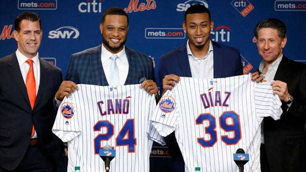 New York Mets' Robinson Cano, second left, and Edwin Díaz, third left, pose with their new jerseys as they are introduced at a news conference at CitiField, in New York, on Dec. 4, 2018.