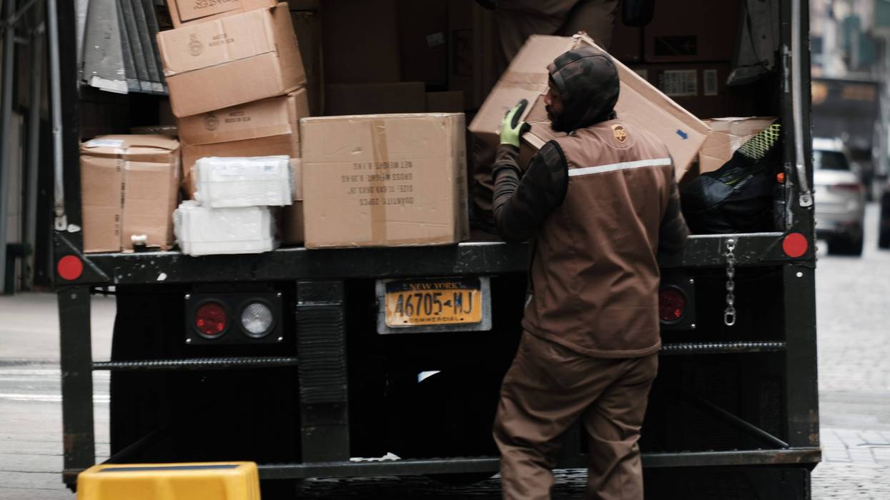 NEW YORK, NEW YORK - APRIL 26: A United Parcel Service (UPS) worker delivers boxes in Manhattan on April 26, 2022 in New York City. The Atlanta-based courier announced that revenue rose 6.4% to $24.4 billion in the first quarter.