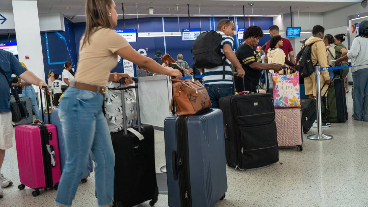 NEW YORK, NEW YORK - JULY 02: People move through a crowded JFK International Airport days before the 4th of July holiday on July 02, 2024 in New York City. As the summer travel season takes off, millions of Americans and tourists are experiencing long delays and congestion at airports, train stations and on highways. July is the busiest month of travel in the U.S.. (Photo by Spencer Platt/Getty Images)