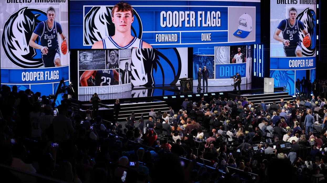 NEW YORK, NEW YORK - JUNE 25: Cooper Flagg (R) shakes hands with NBA commissioner Adam Silver (L) after being drafted first overall by the Dallas Mavericks during the 2025 NBA Draft at Barclays Center on June 25, 2025 in the Brooklyn borough of New York City. (Photo by Mike Lawrie/Getty Images)