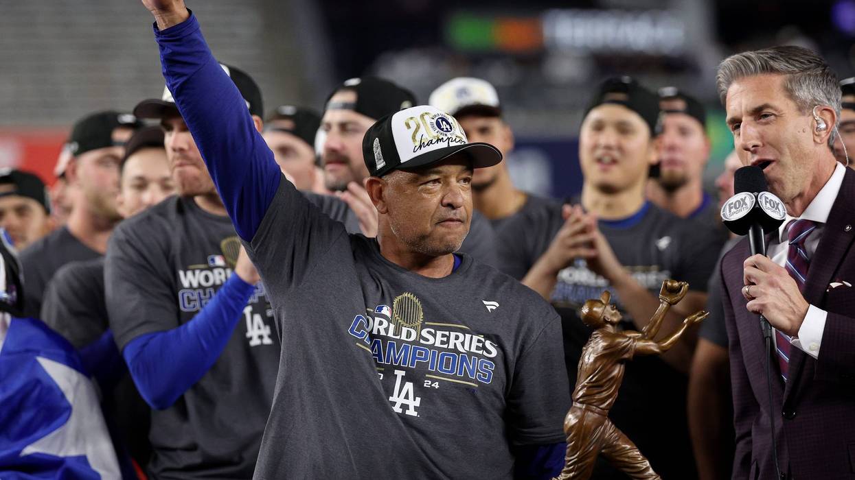 NEW YORK, NEW YORK - OCTOBER 30: Manager Dave Roberts #30 of the Los Angeles Dodgers celebrates after the Dodgers defeated the New York Yankees 7-6 in game 5 to win the 2024 World Series at Yankee Stadium on October 30, 2024 in the Bronx borough of New York City.