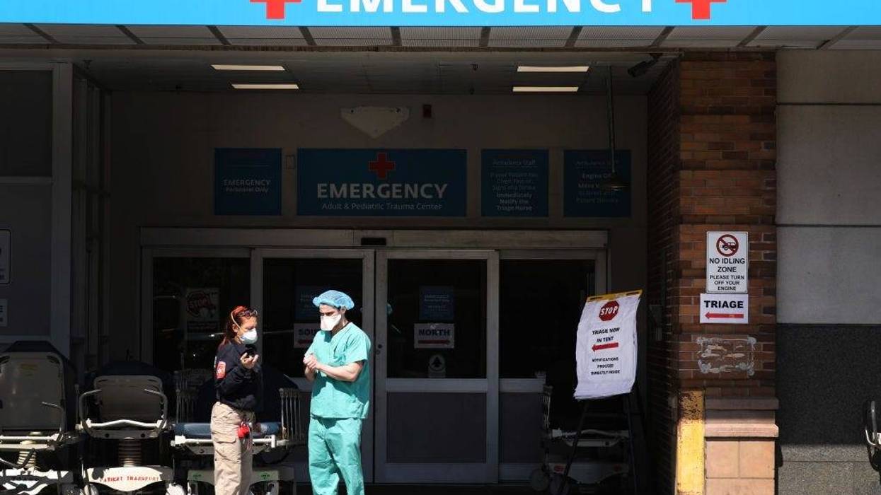 NEW YORK, NY - APRIL 02: Medical workers wait for patients at a special coronavirus intake area at Maimonides Medical Center