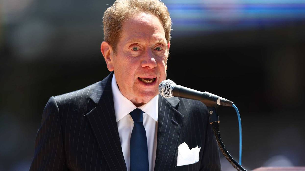 NEW YORK, NY - JULY 30: New York Yankees radio broadcaster John Sterling emcees the Old Timers Day Ceremony before a game between the Kansas City Royals and New York Yankees at Yankee Stadium on July 30, 2022 in New York City.