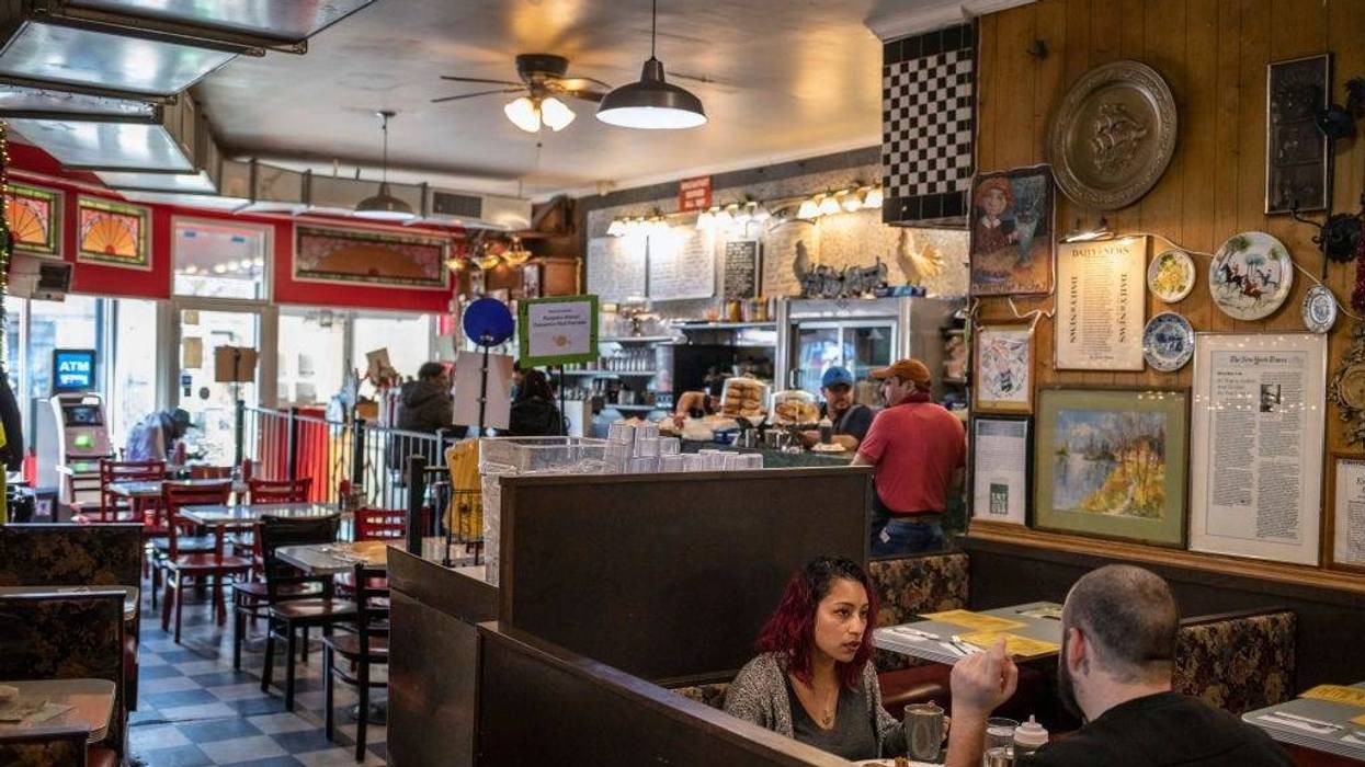 NEW YORK, NY - MARCH, 16: Patrons eat at Tom's Restaurant in the Prospect Heights neighborhood of Brooklyn on March 16, 2020 in New York City. In another measure to try and contain the spread of the Coronavirus all bars and restaurants were ordered to clo