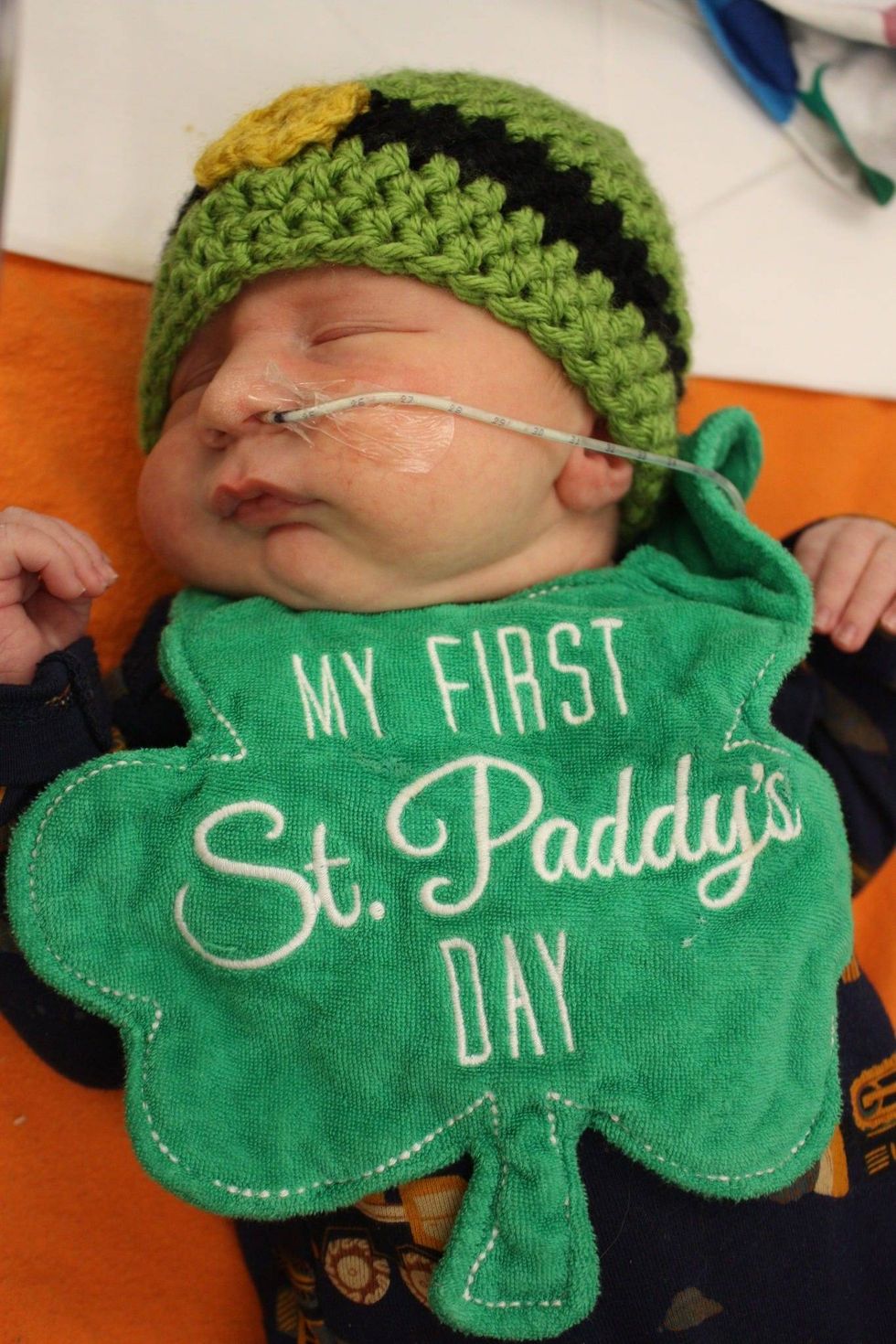Newborn wearing St. Patrick