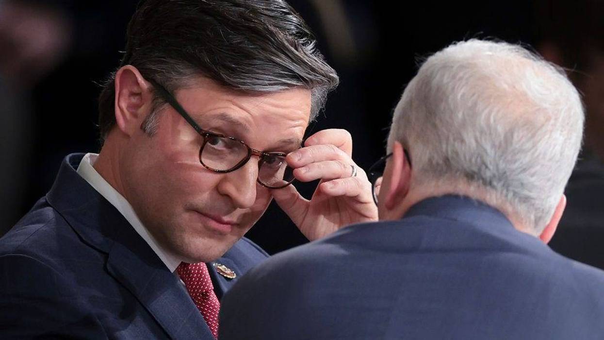 Newly elected Speaker of the House Rep. Mike Johnson (R-LA) speaks with Speaker pro tempore Patrick McHenry (R) (R-NC) in the House chamber after his election at the U.S. Capitol on October 25, 2023 in Washington, DC. After a contentious nominating period that has seen four candidates over a three-week period, Johnson was voted in to succeed former Speaker Kevin McCarthy (R-CA), who was ousted on October 4 in a move led by a small group of conservative members of his own party (Photo by Win McNamee/Getty Images)