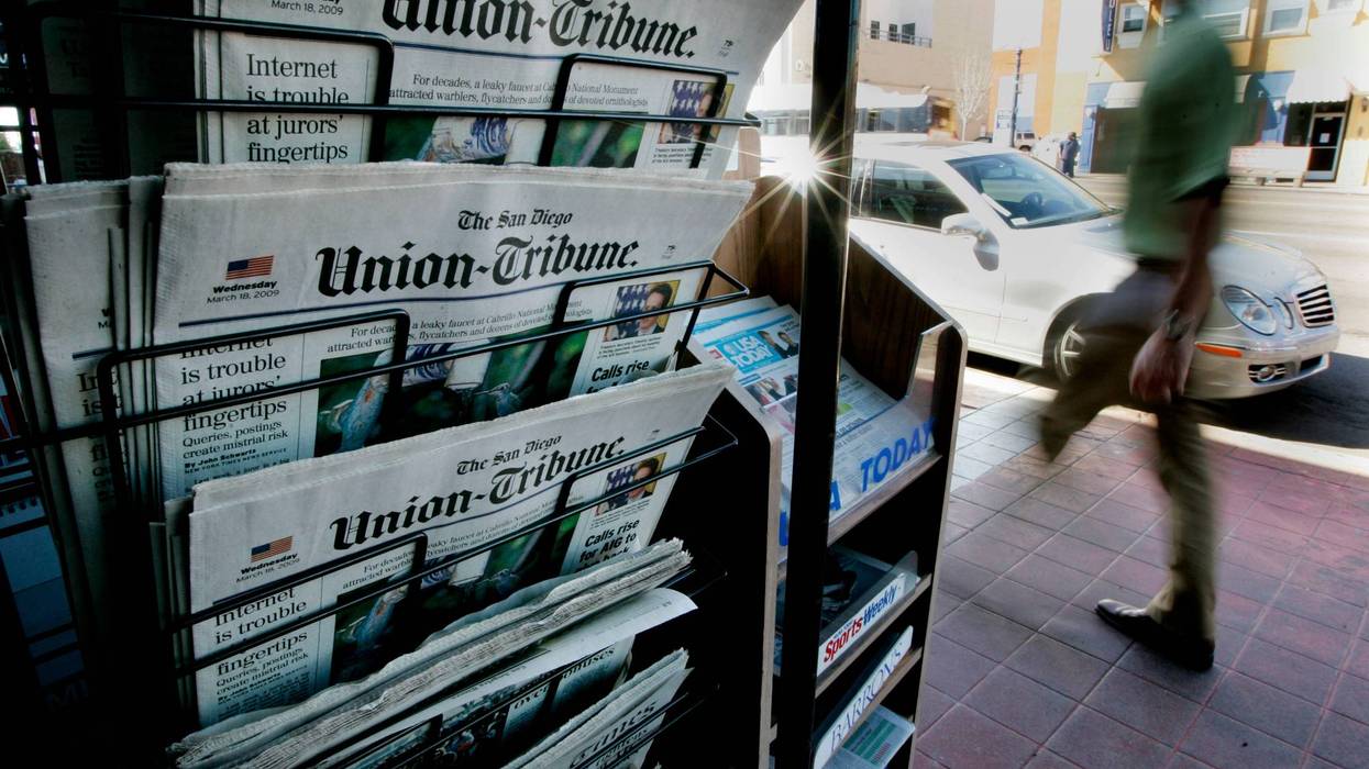 newsstand with copies of the union-tribune